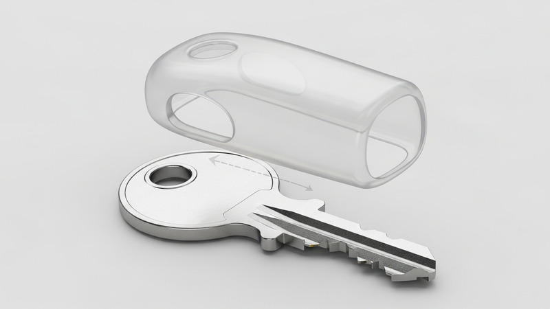 A 3D exploded-view graphic showing a standard metal key. A translucent silicone cover is suspended above it, perfectly aligned to slide down over the key's bow.